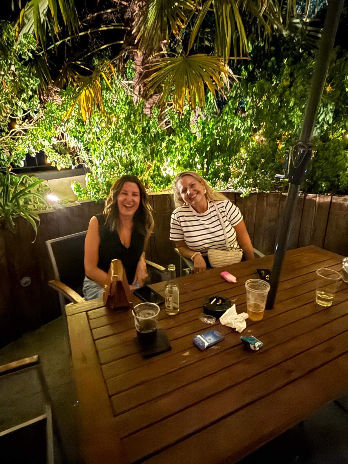 Guests filling the garden at The Bell Inn Hampton on a summer evening